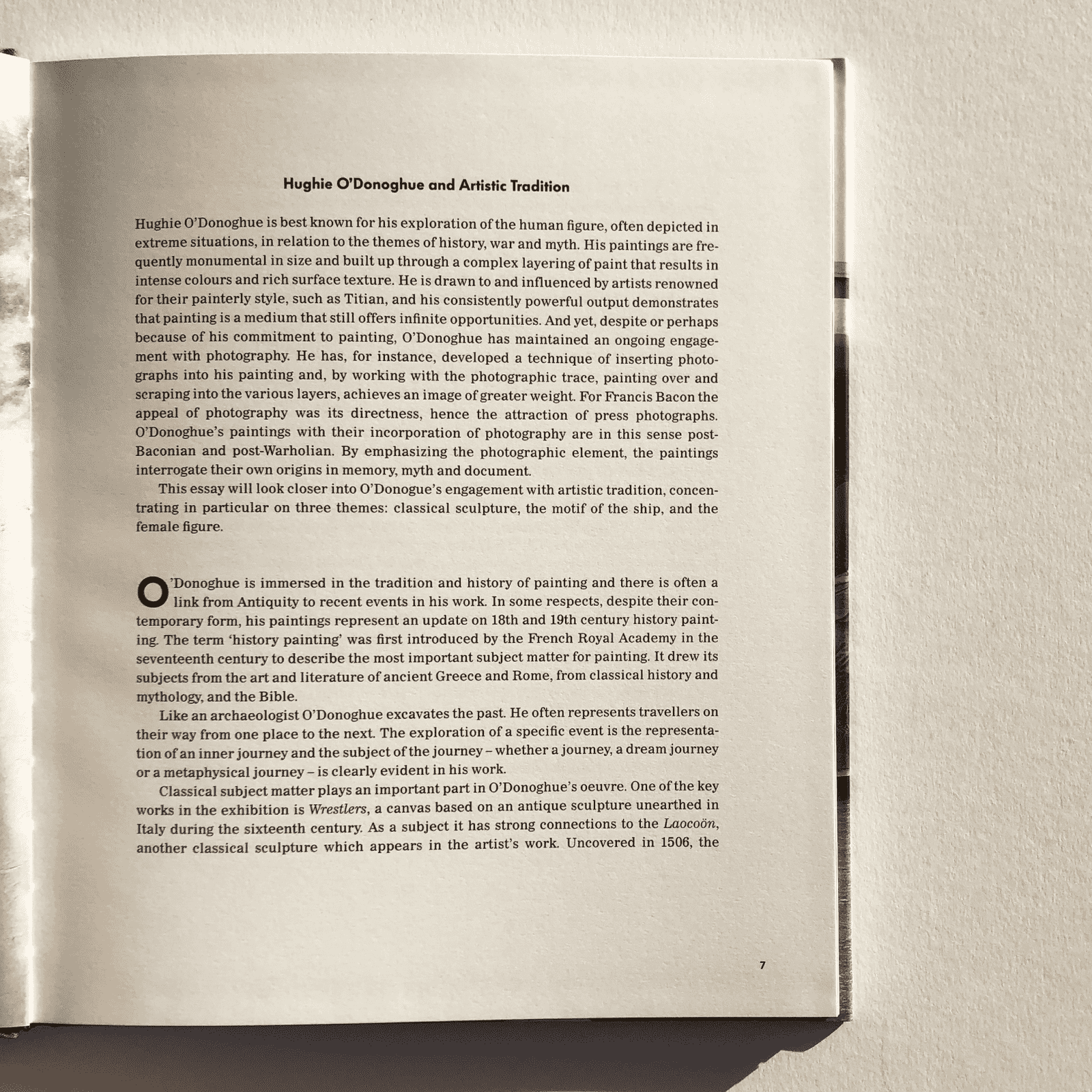 Open book with text on a plain background