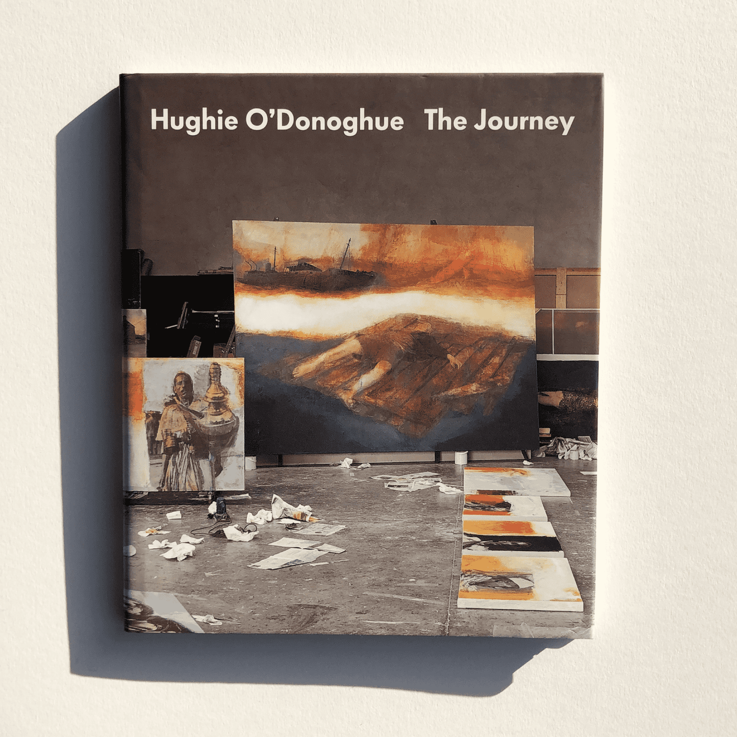 Book titled 'The Journey' by Hughie O'Donoghue with artistic cover design.