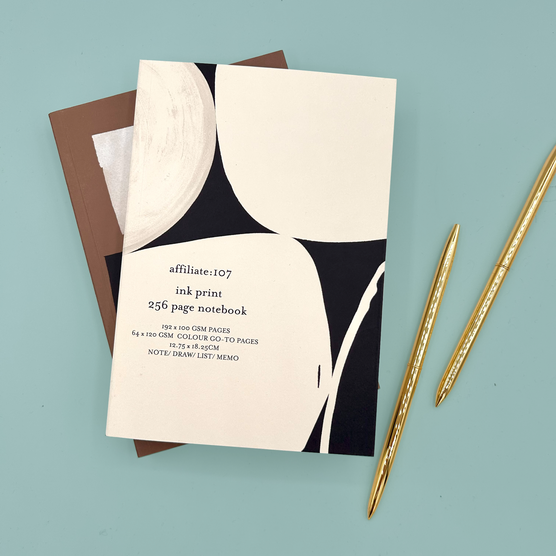 Notebook with black and white design on a light blue background