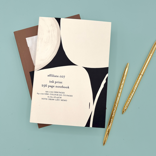 Notebook with black and white design on a light blue background