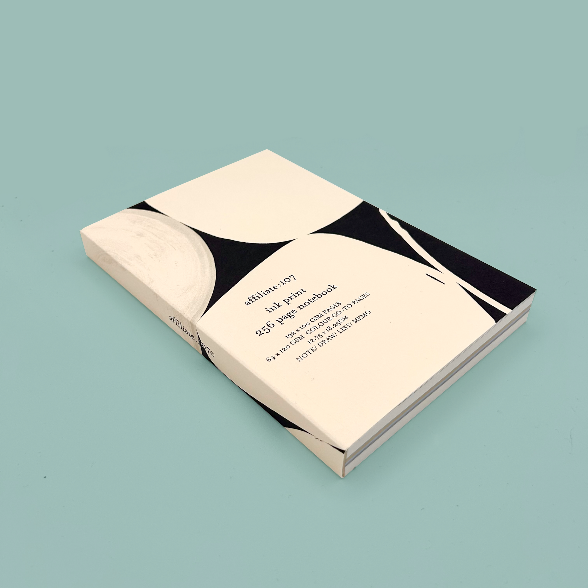 Notebook with geometric design on a light blue background