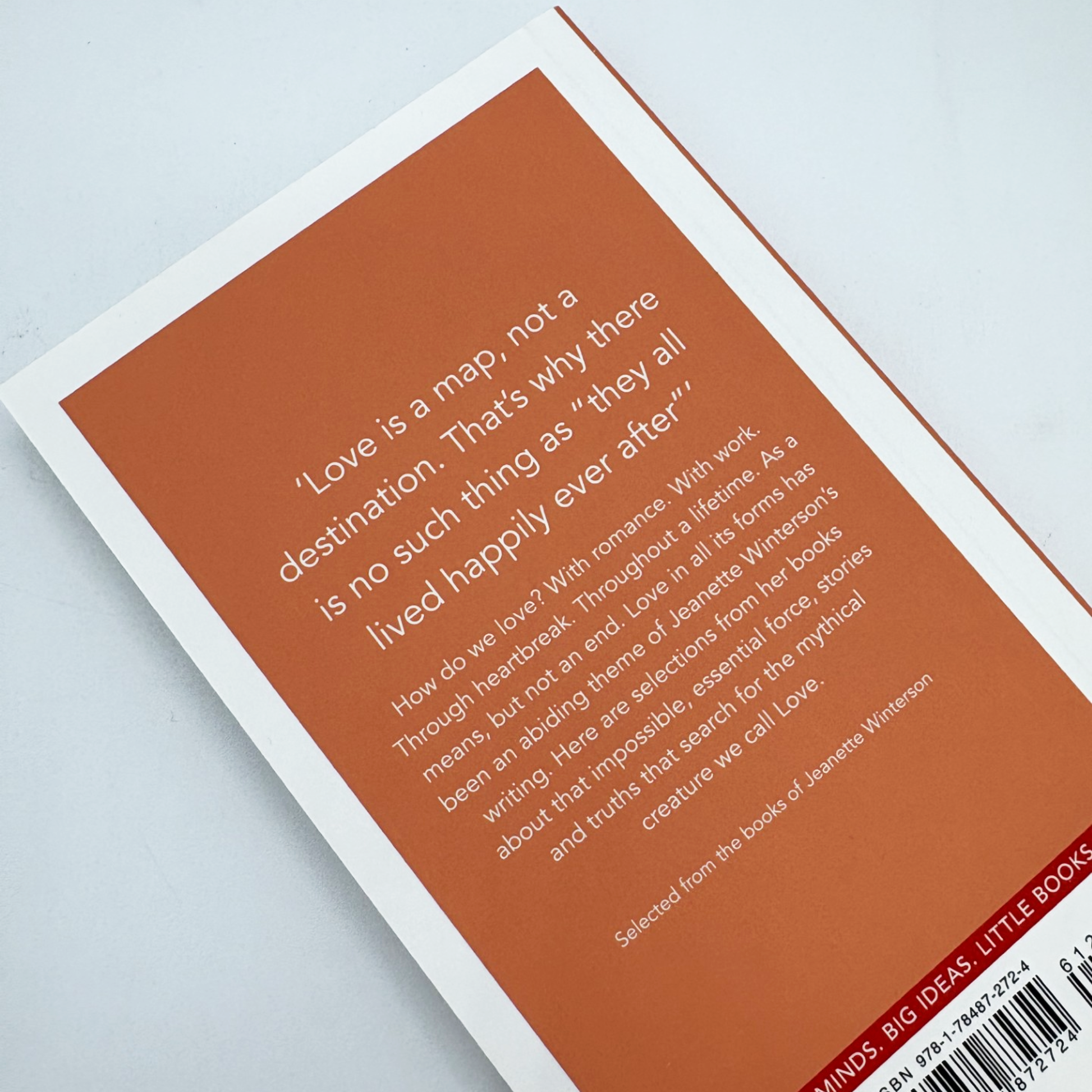 Book with a quote on a light gray background