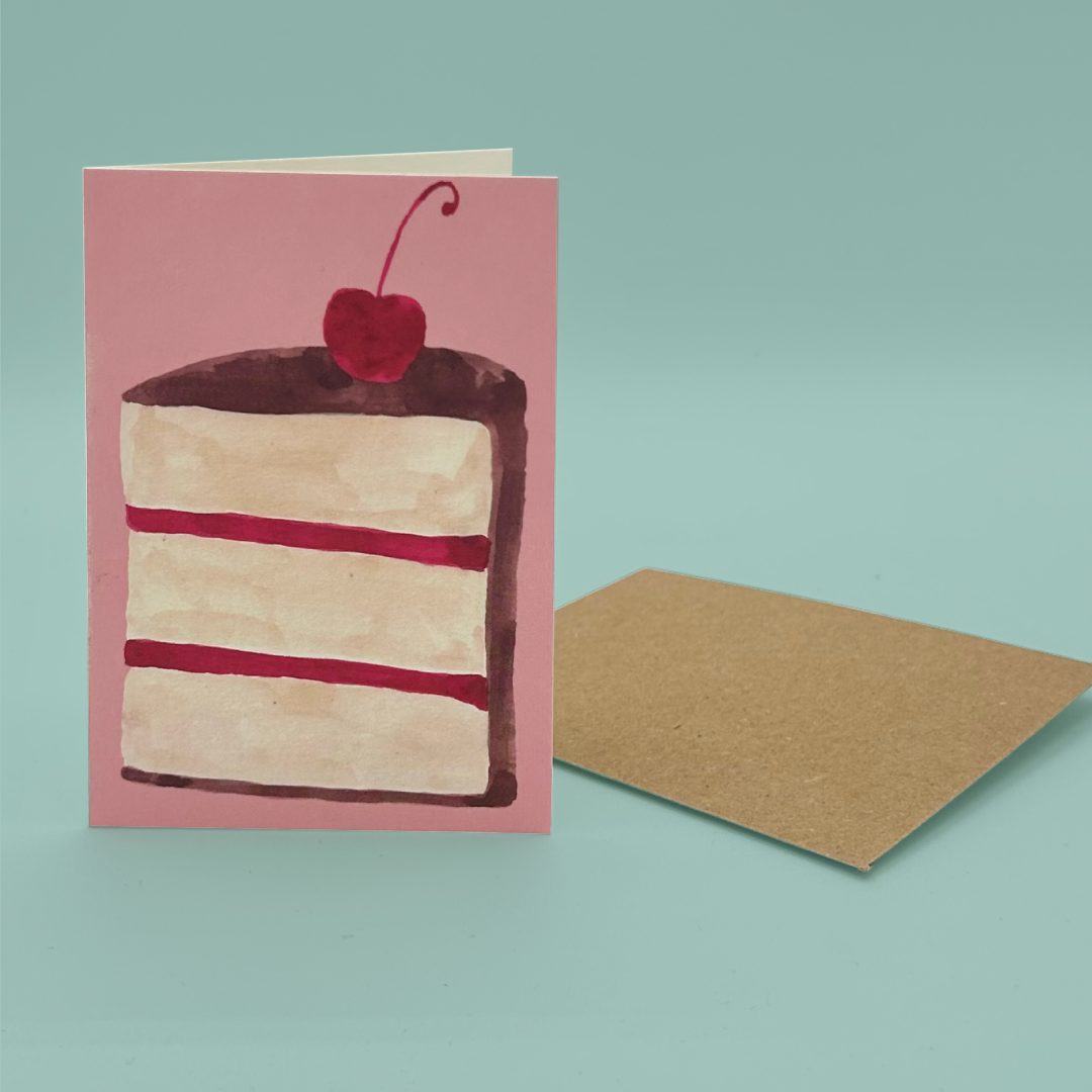 Card with a slice of cake illustration and a cherry on top, placed on a light blue background.