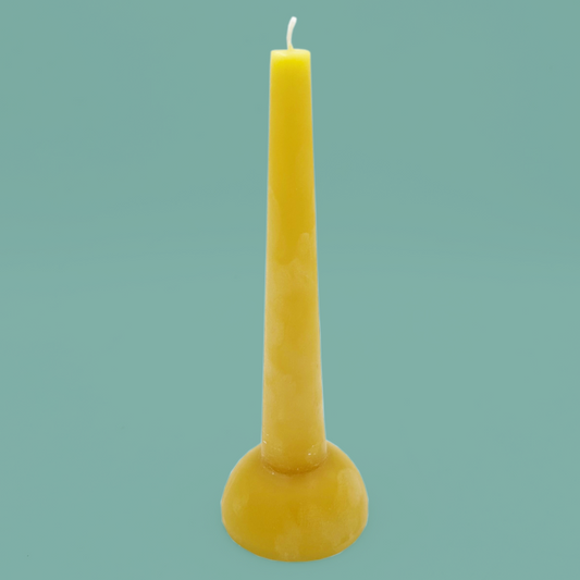 Yellow candle with a curved base.