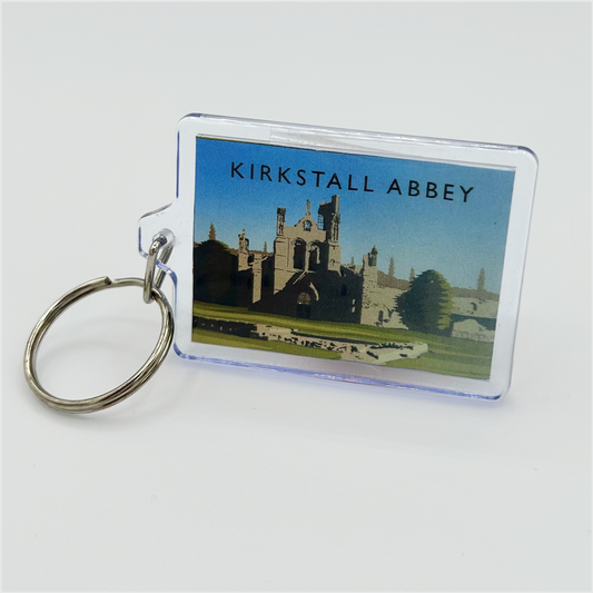 A keyring featuring an illustration of Kirkstall Abbey, on a light grey background.