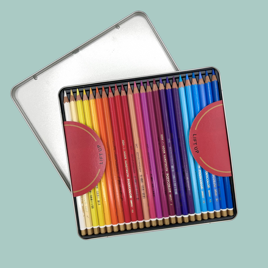 Set of colored pencils in a metal tin on a light blue background