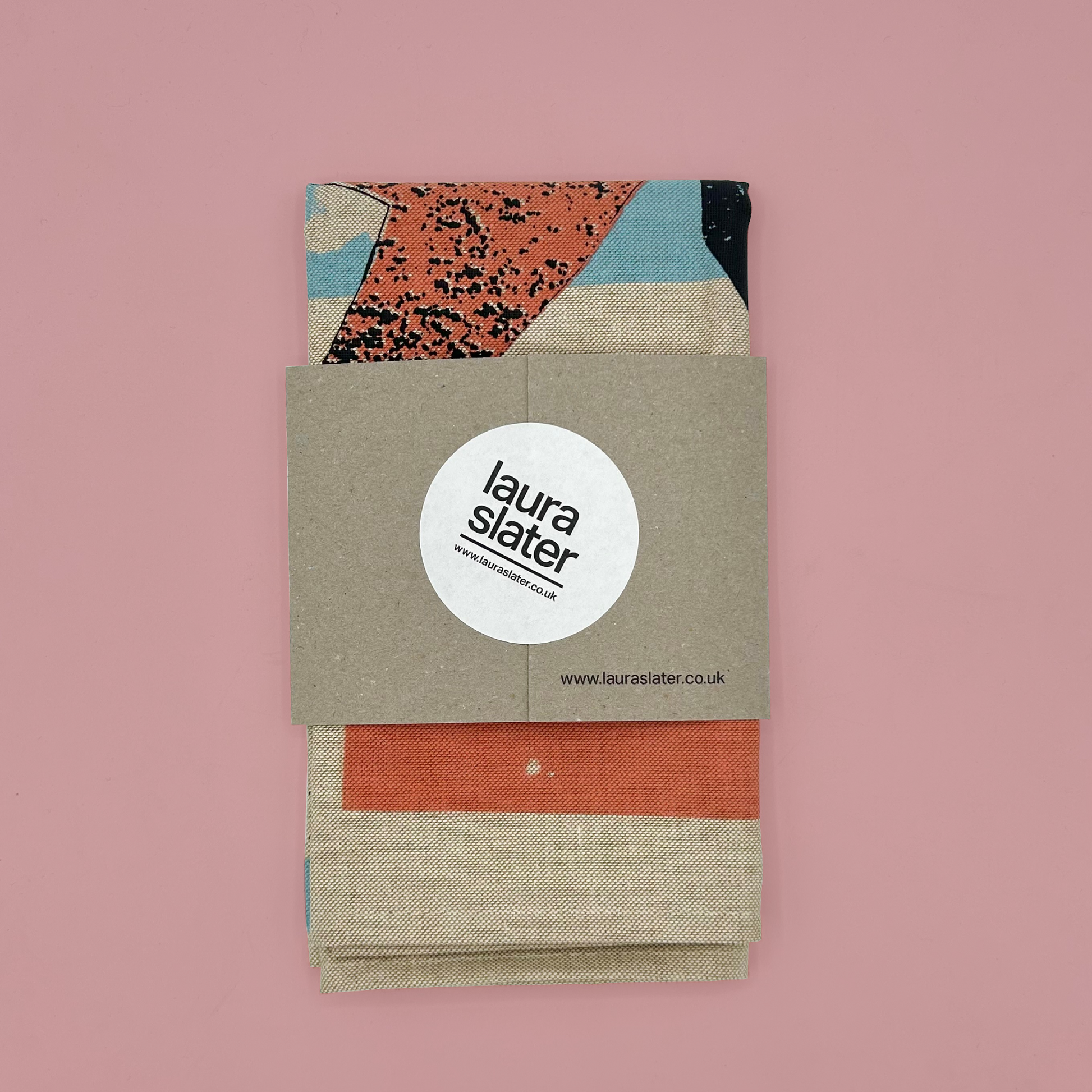 Packaged product with 'laura slater' branding on a pink background