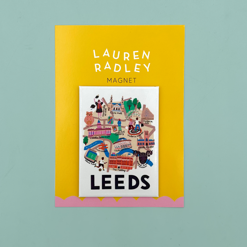 Yellow and pink packaging which reads 'Lauren Radley Magnet.' The magnet itself is white with a ditigtally designed map illustration of Leeds and 'LEEDS' in black handwritten font.