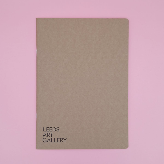 Brown notebook with 'Leeds Art Gallery' text on a pink background