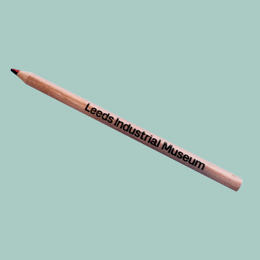Wooden pencil with 'Leeds Industrial Museum' text on a light blue background