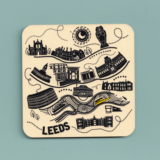 Coaster with black illustrations of buildings and landmarks on a light blue background