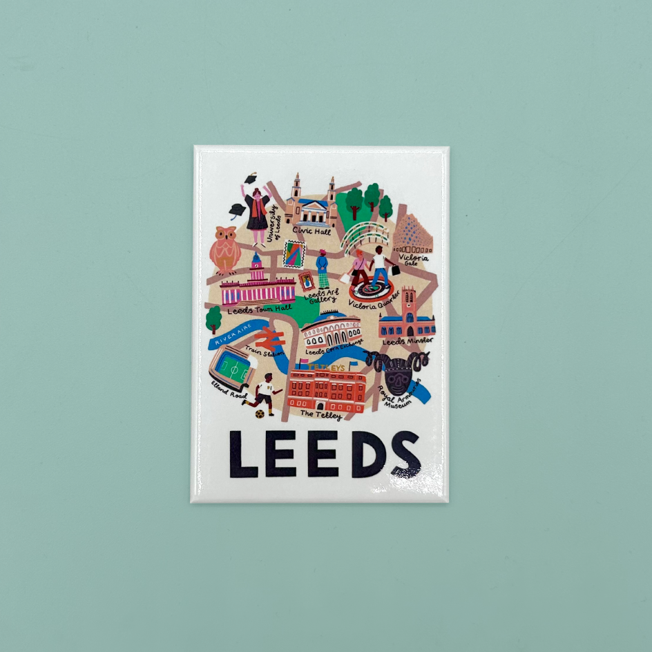 A rectangular white magnet featuring a colorful illustrated map of Leeds with the word 'LEEDS' in large black letters at the bottom, shown against a solid light teal background.