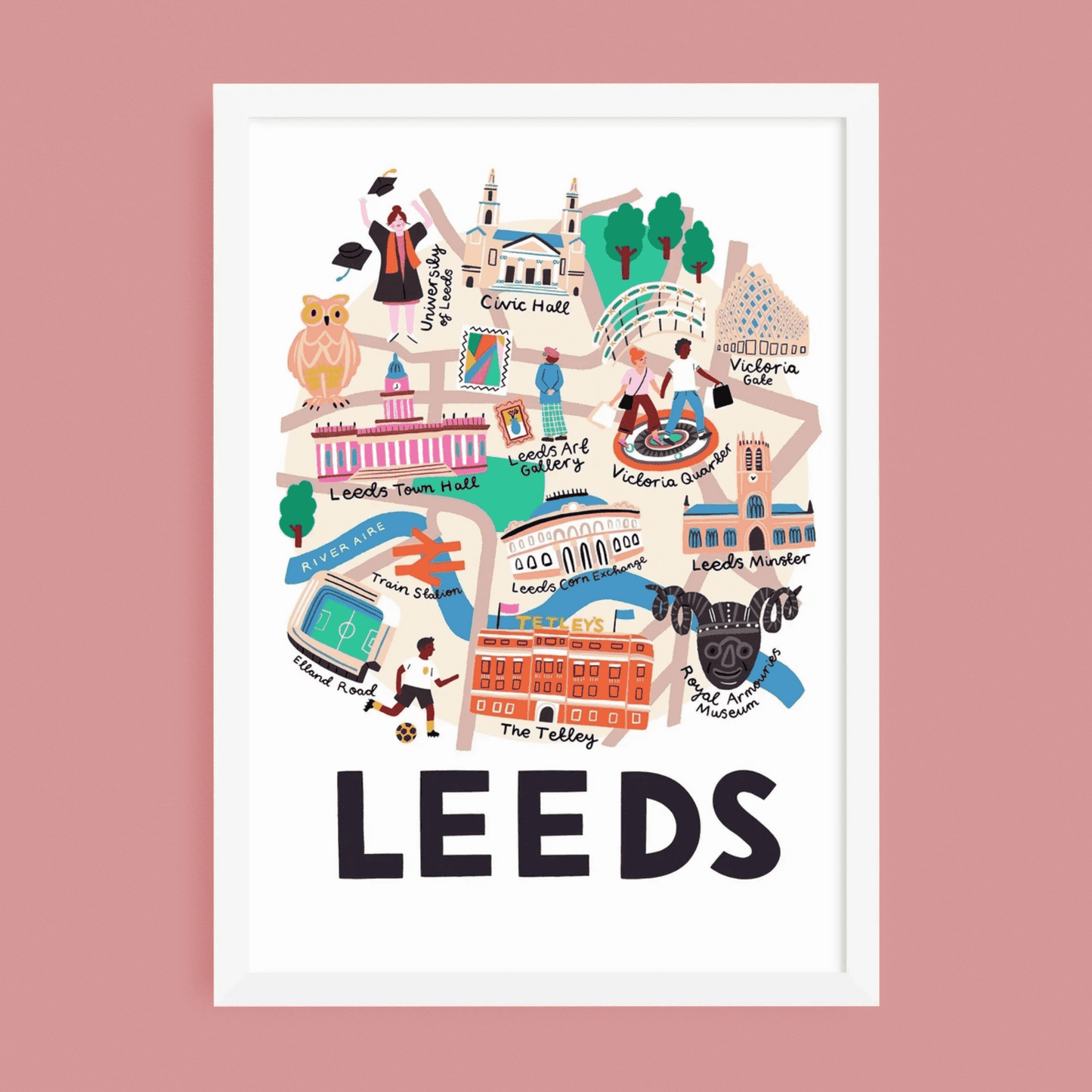 A framed art print featuring a colorful illustrated map of Leeds, with the word 'LEEDS' in large black letters at the bottom, shown against a solid pink background.