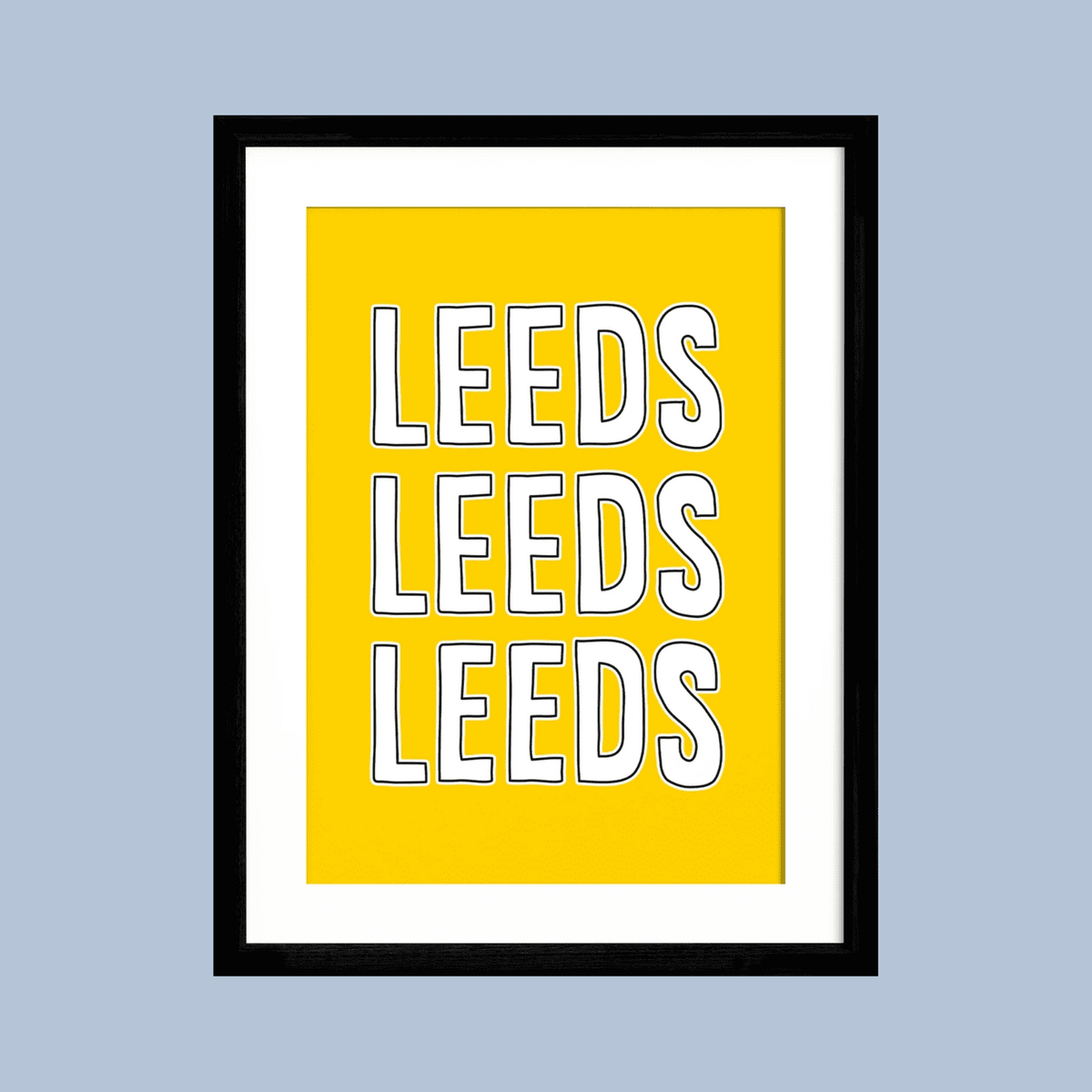 Framed poster with 'LEEDS' text on a yellow background