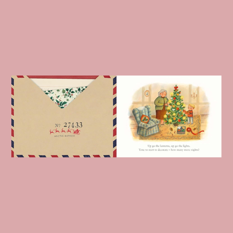 A Christmas-themed book spread of a postcard and matching envelope shown on a dusty pink background. The postcard features a vintage illustration of a cozy living room with a Christmas tree, children, and a dog and with text.