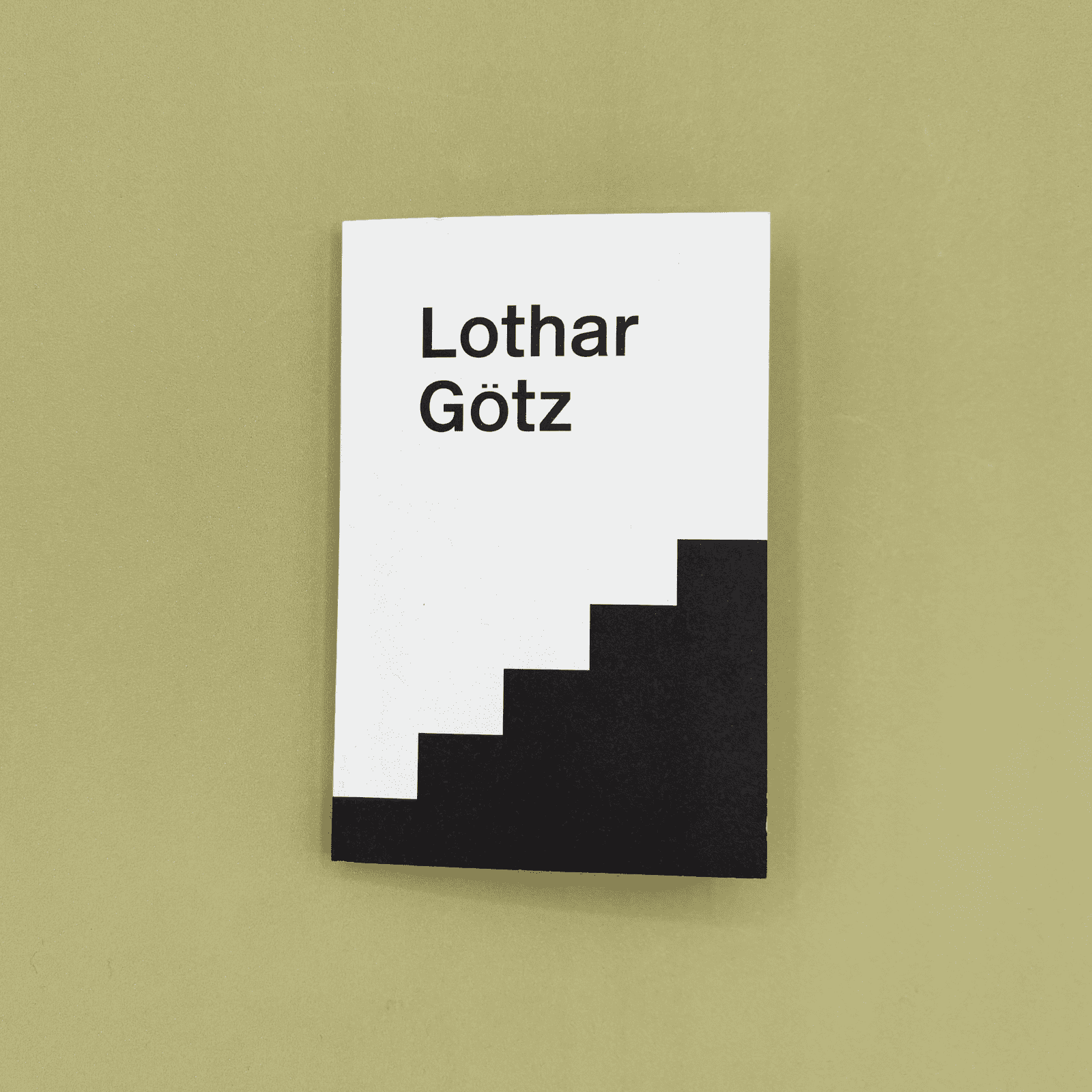 Book cover with 'Lothar Gotz' text on a white background with black steps against a beige background