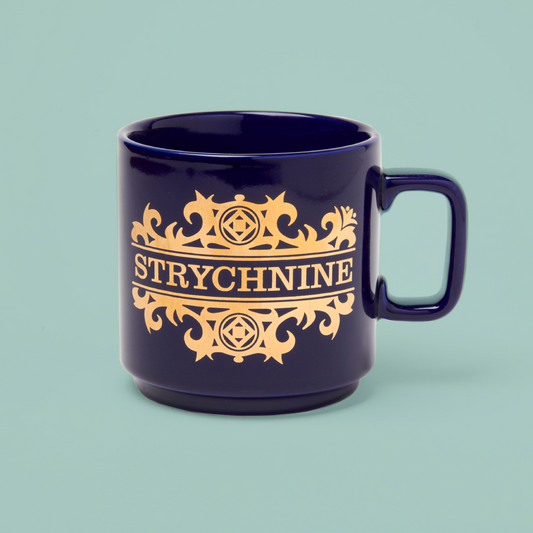 Blue mug with gold text and embellishments, on a teal background. 