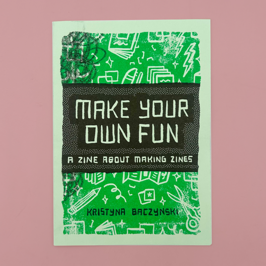 A book cover titled 'MAKE YOUR OWN FUN: A ZINE ABOUT MAKING ZINES' by Kristyna Baczynski, featuring a green and black graphic design on a dusty pink background.