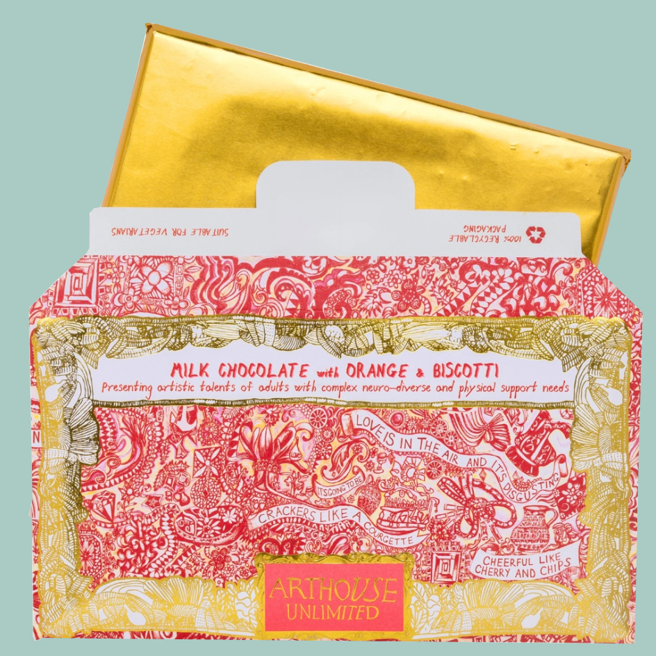 A  chocolate gift bar with a metallic gold foiled bar partially pulled open from the top. The front box is decorated with a red and gold ornate illustration and a white label reading 'MILK CHOCOLATE WITH ORANGE & BISCOTTI.