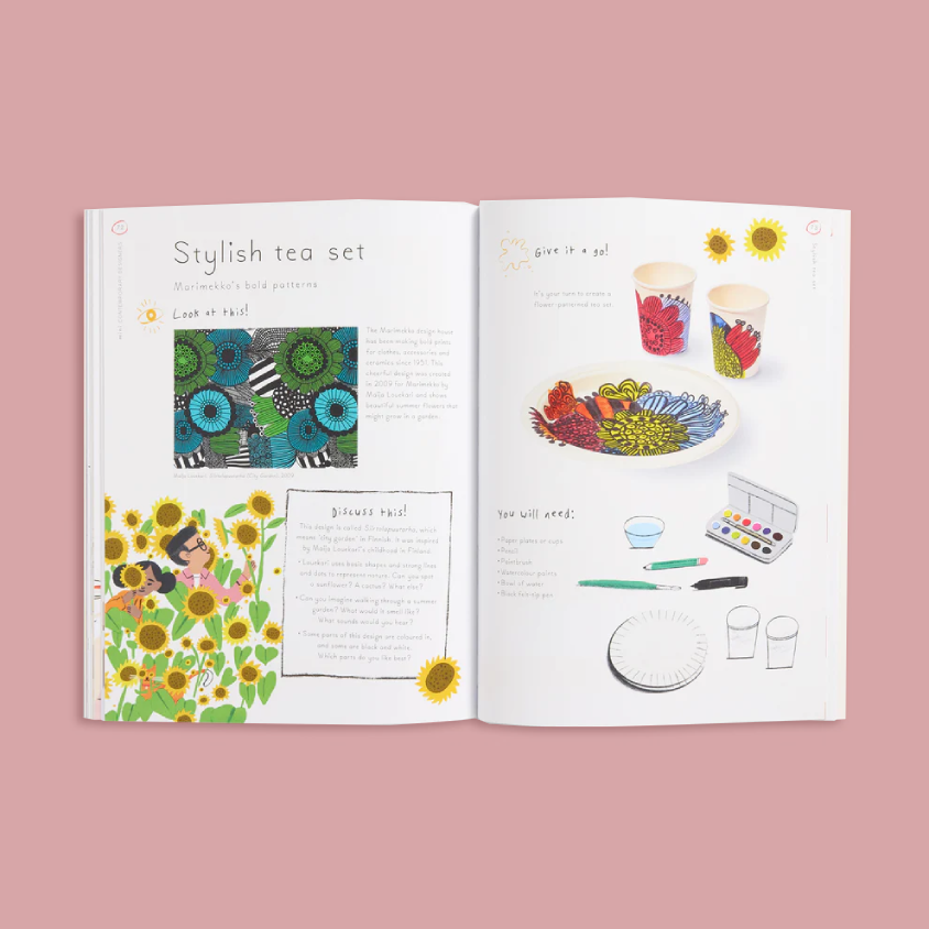 An open children's activity book spread on a solid pink background. The left page is titled 'Stylish tea set' and features a colorful patterned tea set illustration, while the right page shows a paint-and-write activity with cups, a plate, and art supplies.