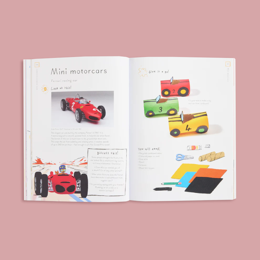 An open children's activity book showing pages about making mini motorcars, with illustrations and photos of red race cars and craft supplies on a dusty pink background.