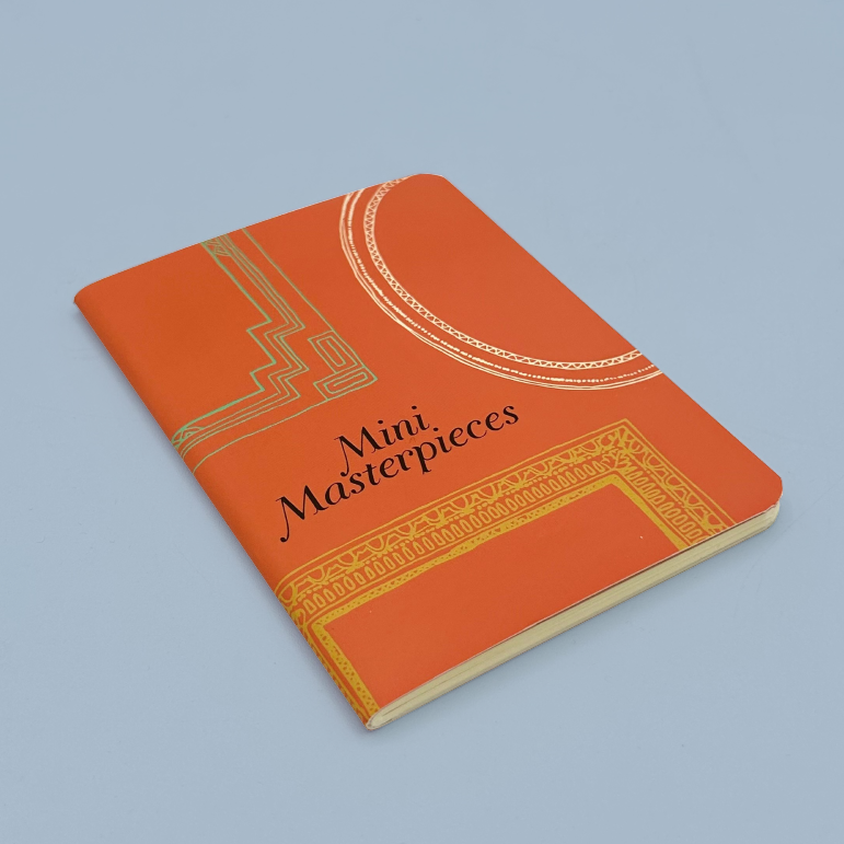Orange notebook with 'Mini Masterpieces' text on a light blue background