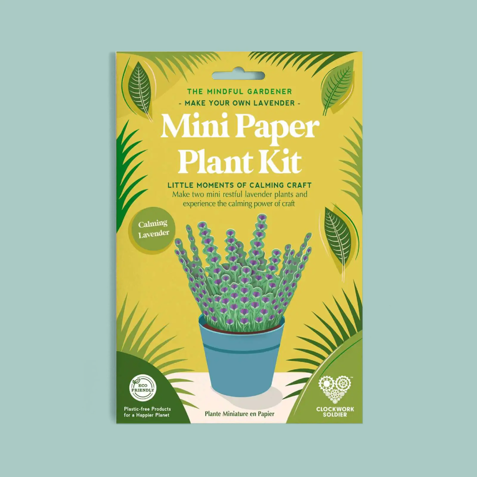 Packaging for the 'Mini Paper Plant Kit' by Clockwork Soldier, featuring a yellow and green design with a paper-cutout lavender plant in a blue pot, set against a solid light blue background.