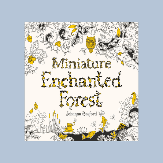 Book cover of 'Miniature Enchanted Forest' by Johanna Basford with decorative forest illustrations on a light blue background