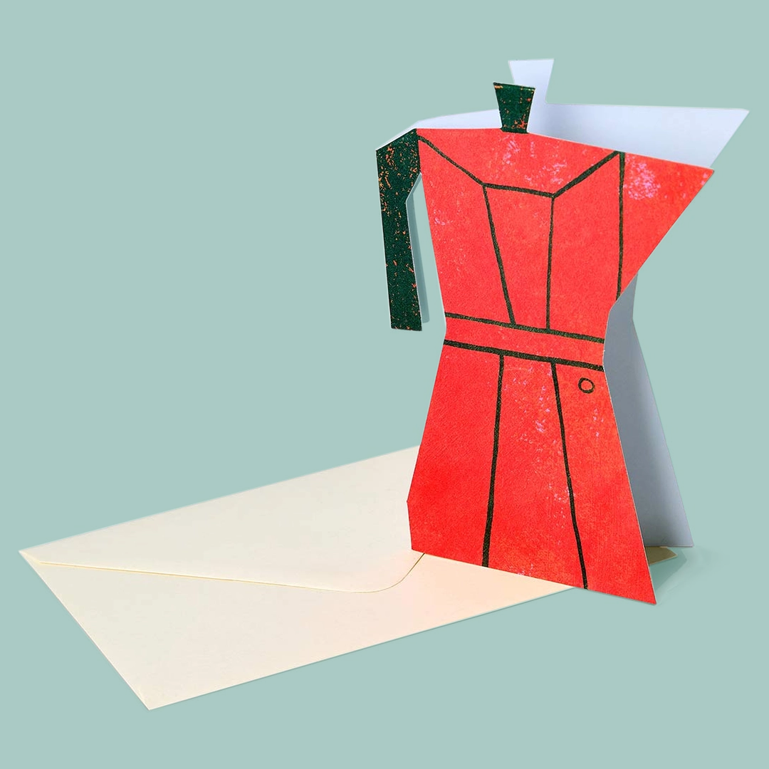Red coffee pot shaped card with a beige envelope on a light blue background