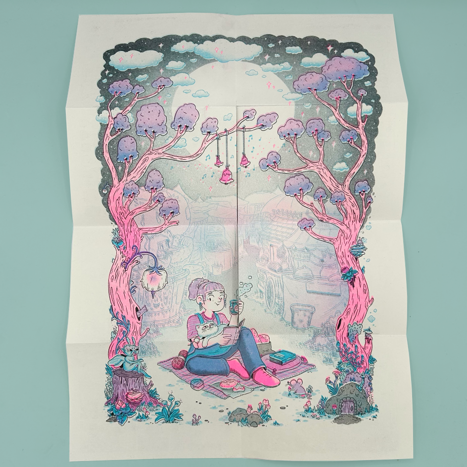 A foldout poster featuring a whimsical illustrated scene of a girl sitting on the ground under pink mushroom trees, holding a glowing rod, with pastel clouds and a village in the background, photographed against a light blue surface.