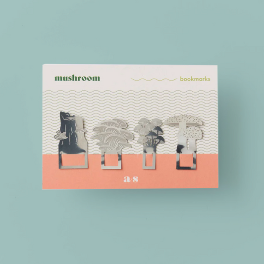 4 mushroom shaped steel bookmarks on a white and pink card.