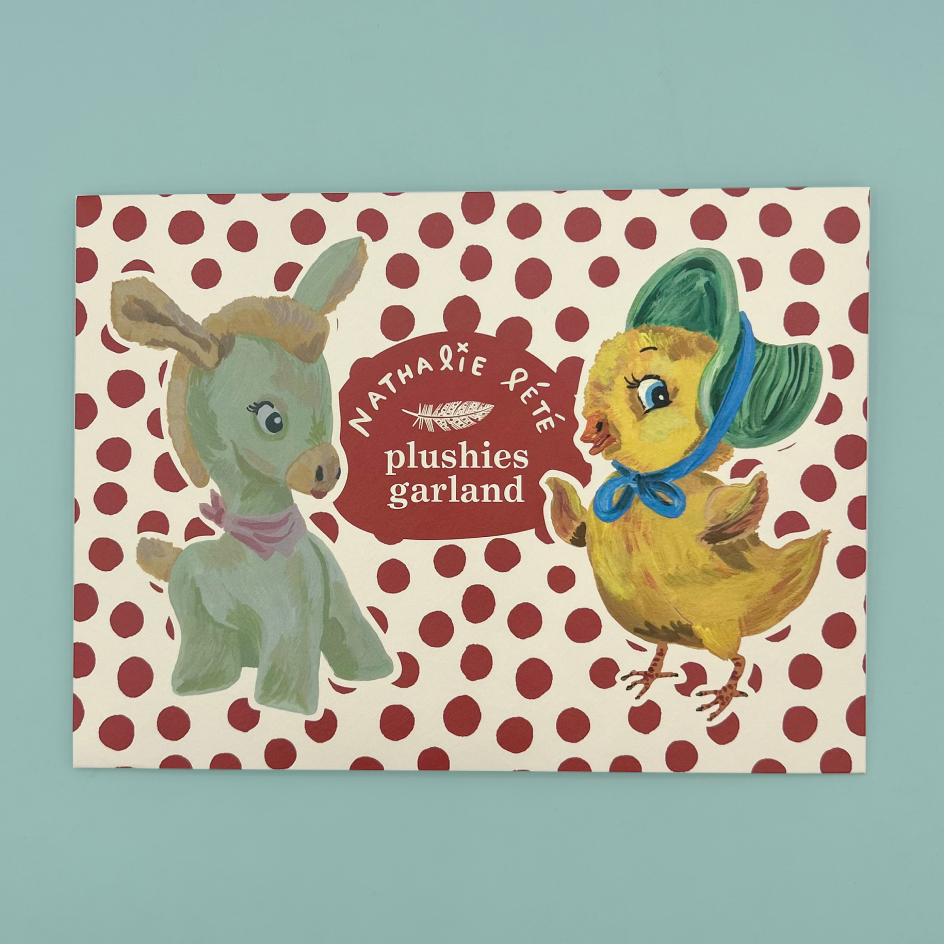 Packagign for a plushies garland featuring a green donkey and a yellow chick with a green bonnet and blue bow, set against a red polka dot pattern on a cream background. The center reads 'Nathalie Rété plushies garland'.