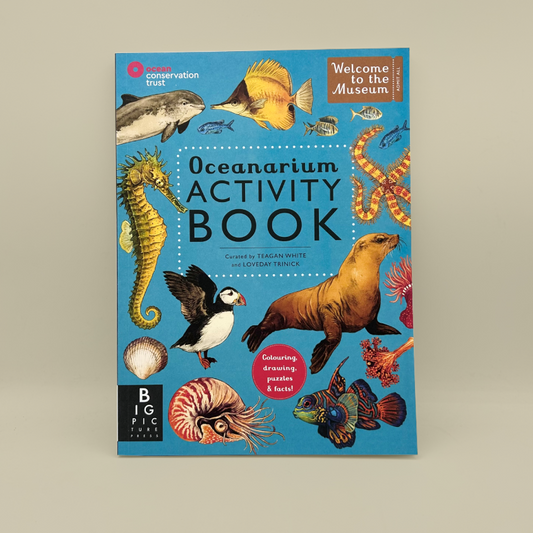 Oceanarium Activity Book, featuring a bright blue cover illustrated with various sea creatures like a seahorse, lionfish, octopus, and sea lion, set against a neutral beige background.