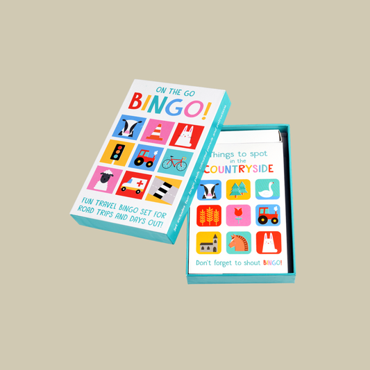 Travel bingo game set with colorful icons on a beige background