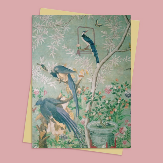 Greeting card with blue birds and floral design on a pink background