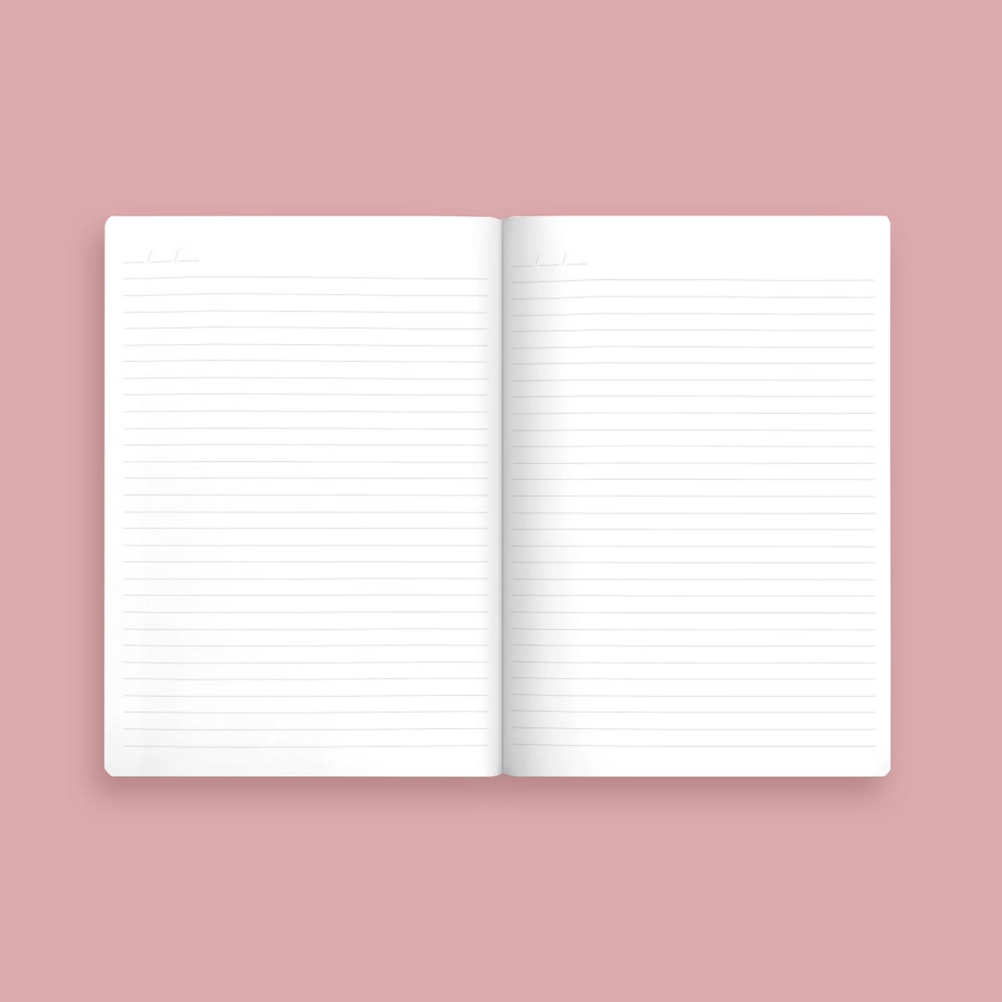 Open notebook with lined pages on a pink background