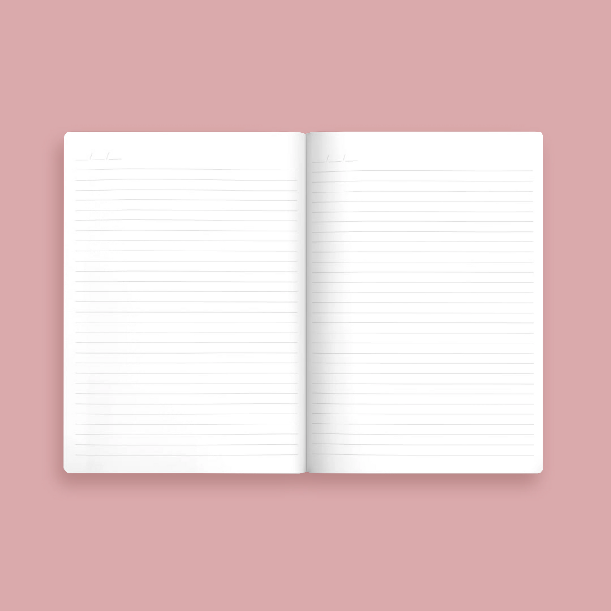Open notebook with lined pages on a pink background