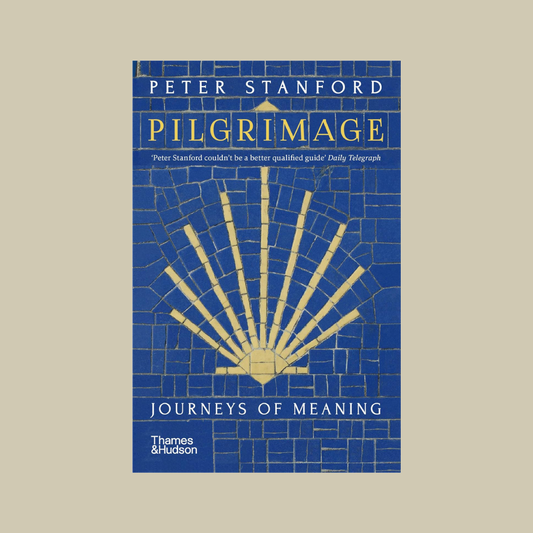 Book cover of 'Pilgrimage: Journeys of Meaning' by Peter Stanford with a blue and gold design.