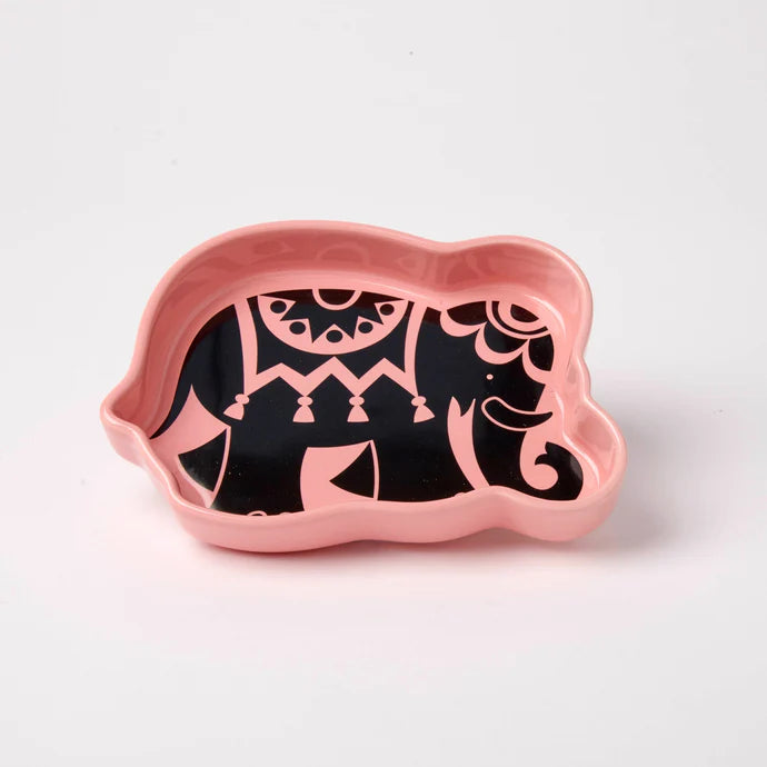 Pink elephant-shaped tinket tray with black geometric pattern on a white background