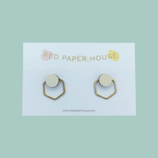 Pair of earrings on a card with 'Red Paper House' branding on a light green background