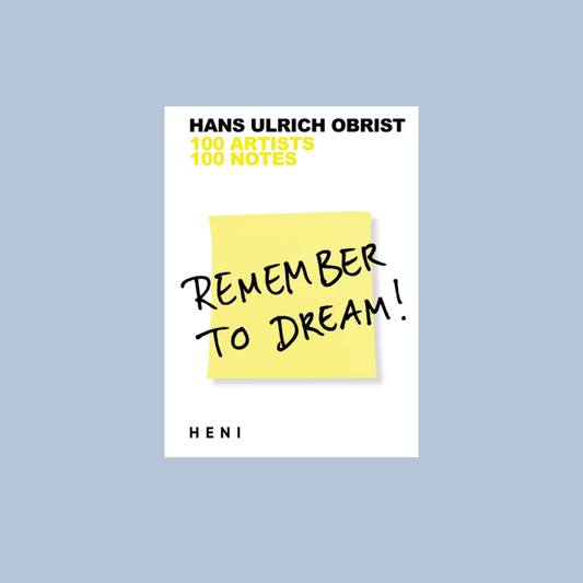 Book cover with yellow sticky note and text on a light blue background