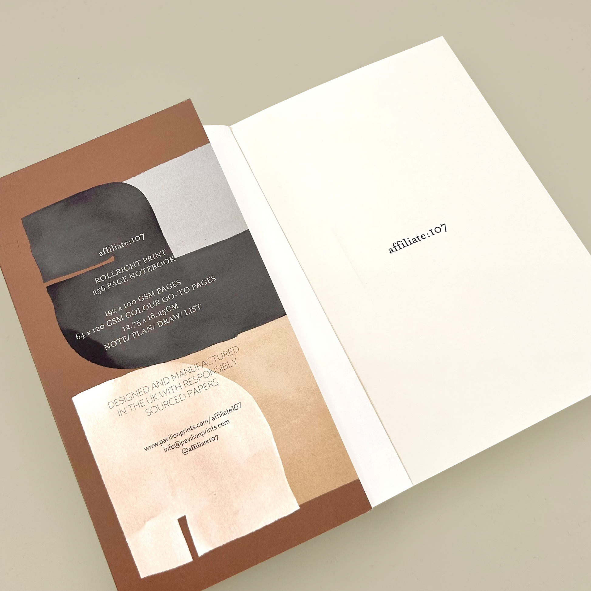 Inside front cover of a notebook with a brown cover and ivory inner pages. 