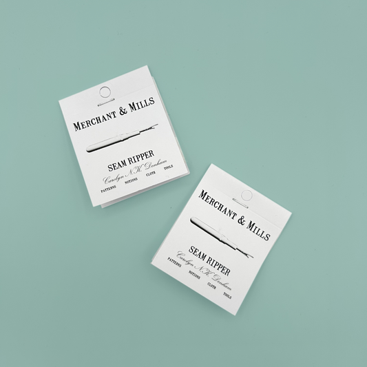 Two packages of Merchant & Mills seam ripper on a light blue background