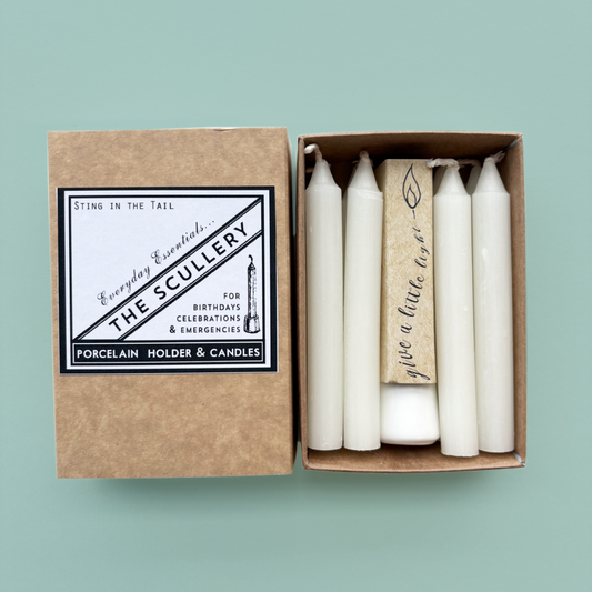 Scullery candle set with image of box sleeve and insert. 8 candles with a porcelain holder on a teal background.