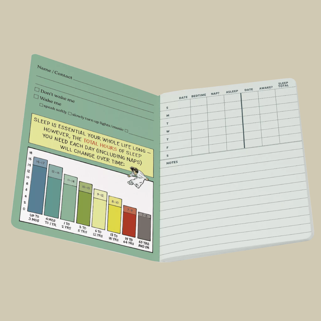 Open notebook with sleep tracking chart on a beige background