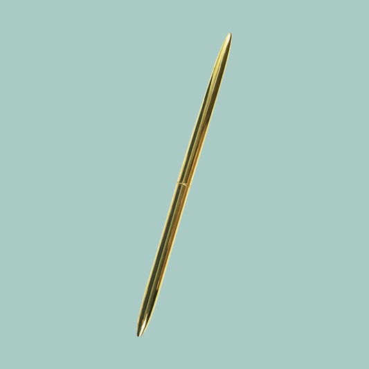 Gold pen on a light blue background