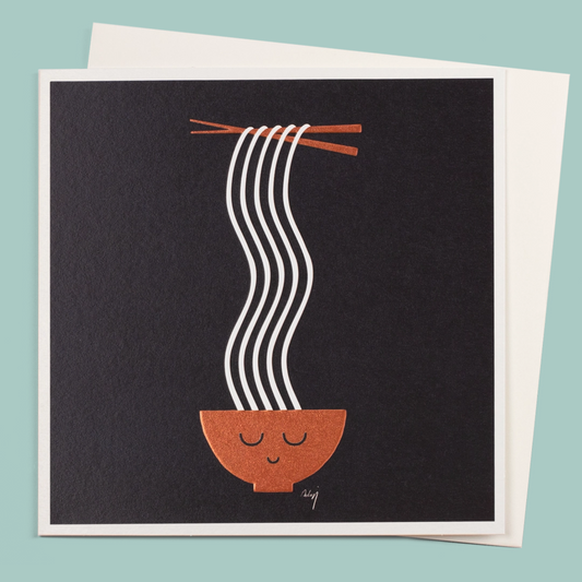 Card with a design of a bowl of noodles with chopsticks on a black background