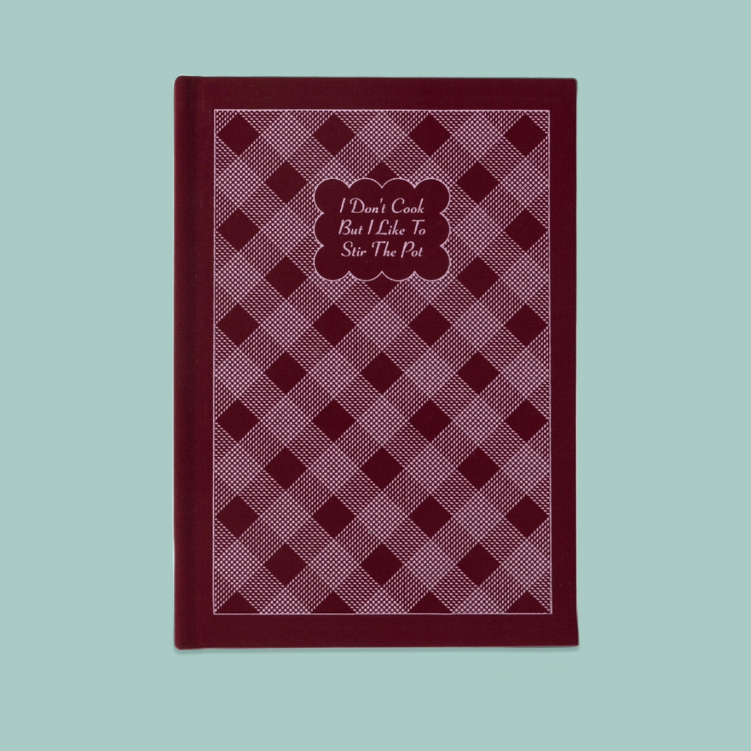Berry gingham fabric notebook with cursive text. 