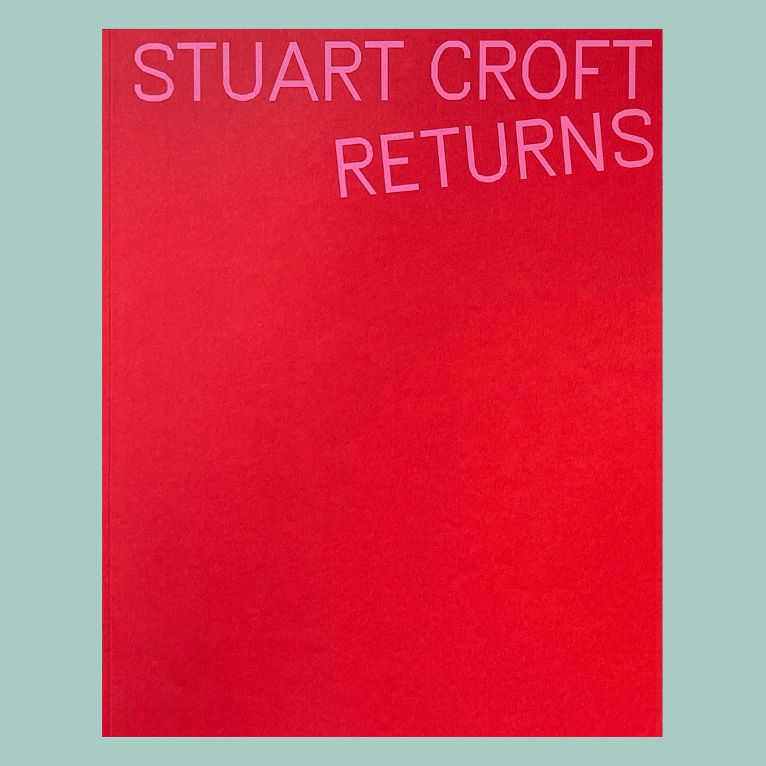 Red book cover with the title 'STUART CROFT RETURNS' in pink text. The book is on a blue background.