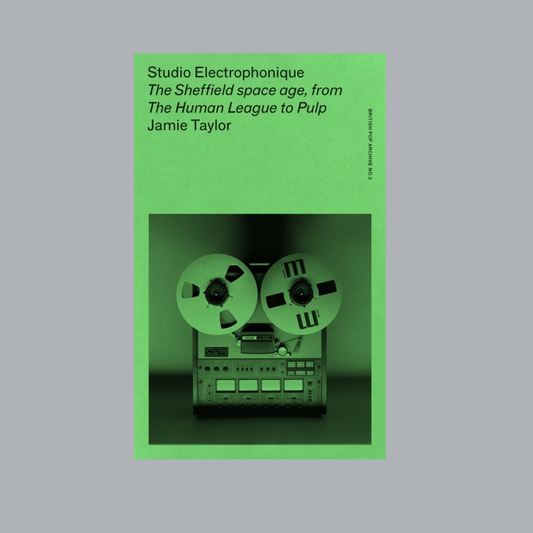 Book cover with a green border featuring a reel-to-reel tape player on a gray background